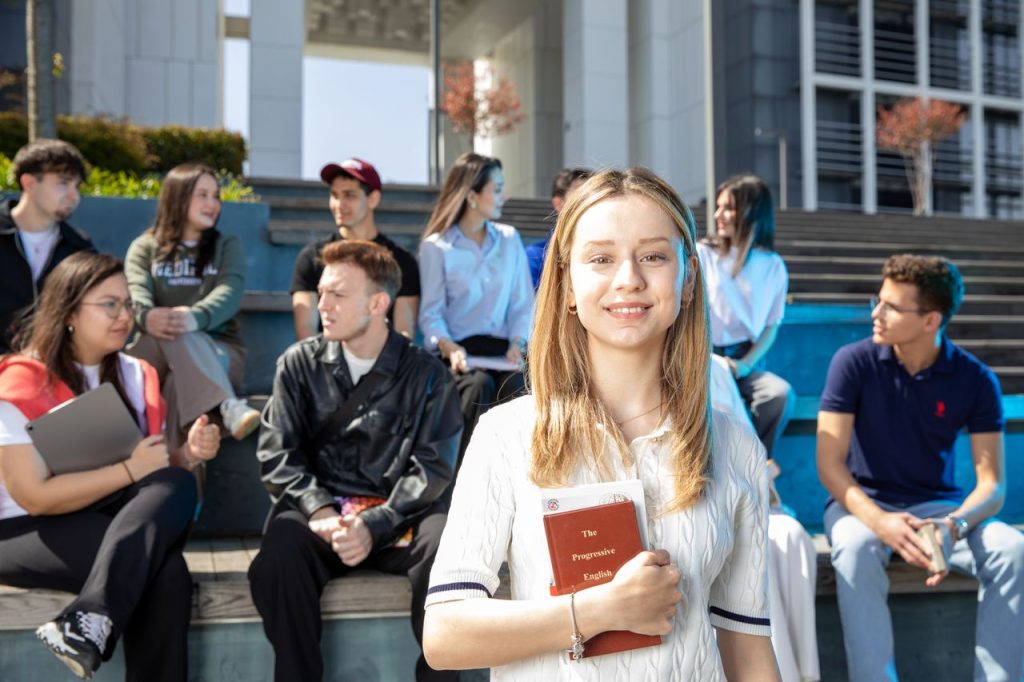 The Art of Drawing Readers In: Your attractive post title goes here Group of young adults socializing on university steps, discussing and studying together.